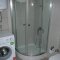Bathroom is equipped with washing machine and shower cabin - Blue Green Apartments Calis Beach