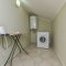 Washing machine and ironing board on the top floor - #2 Neptune Apartment in Sunset Beach Club Calis Fethiye Turkey 