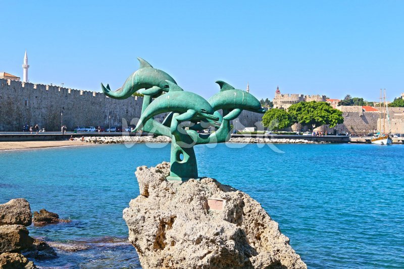 Famous "three dolphins" statue you will see on the exit from Rhodes harbor - Fethiye Rhodes Ferry