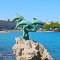 Famous "three dolphins" statue you will see on the exit from Rhodes harbor - Fethiye Rhodes Ferry