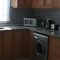 Open plan kitchen with microwave, kitchen pots and washing machine - Oriana villas in Ovacik