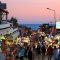 Main street with numerous bars, restaurants and shops in town of Oludeniz Turkey