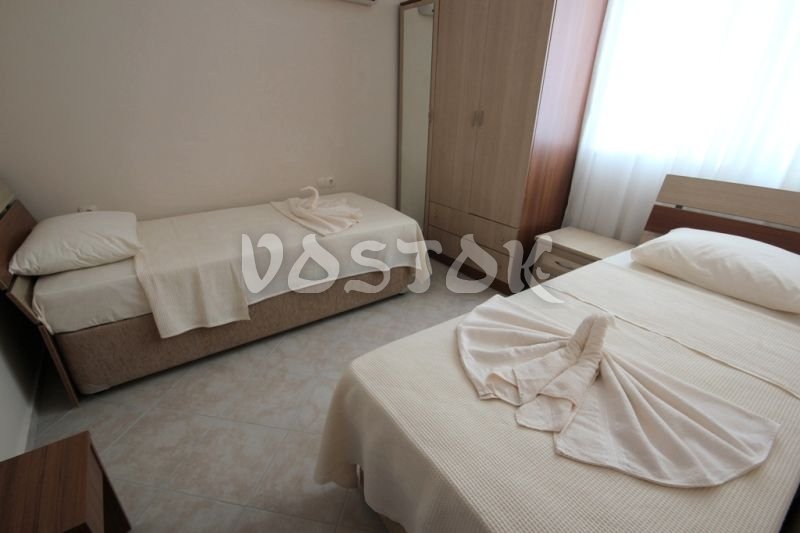 Bedroom with two beds - Sunset Poseidon Apartments in Calis Fethiye