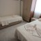 Bedroom with two beds - Sunset Poseidon Apartments in Calis Fethiye