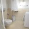 Bathroom with shower cabin and washing machine - Sunset Aqua Apartments in Calis Turkey
